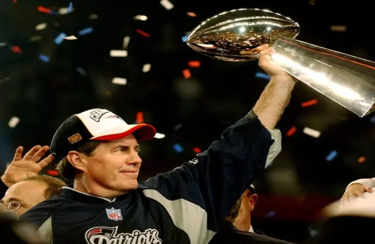 Belichick raising the Vince lombardi Super Bowl Trophy