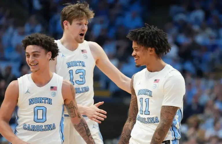 UNC Tar Heels guard Kyan Evans (0) and center Henri Veesaar (13) and forward Jonathan Powell (11) react in the first half at Dean E. Smith Center. North Carolina University