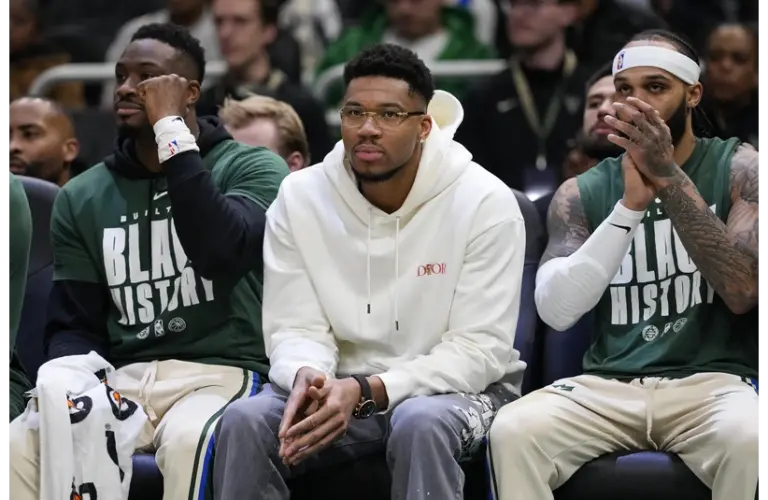 Giannis on the sideline watching the game