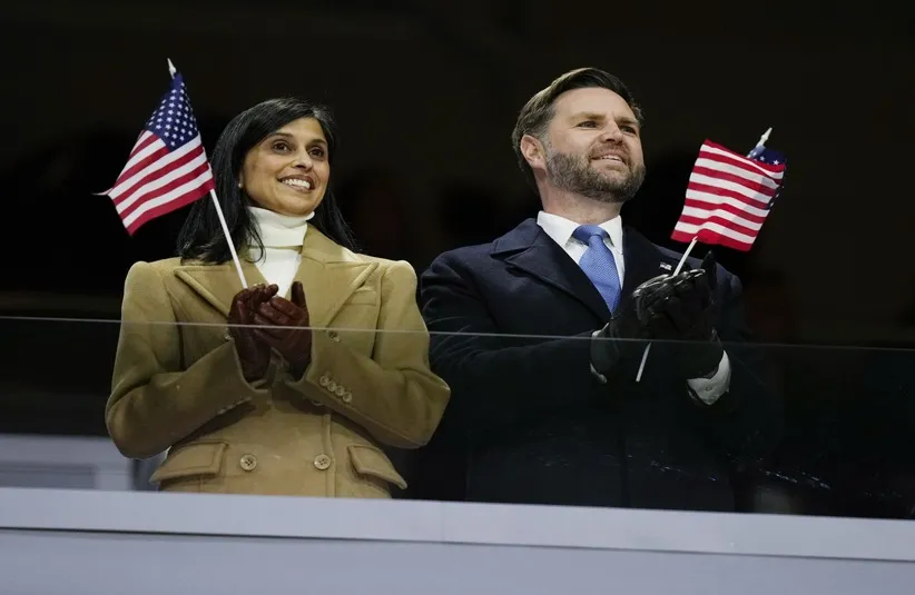 United States Vice President JD Vance and second lady Usha Vance wave American flags during the Opening Ceremony for the Milano Cortina 2026 Olympic Winter Games at Milano San Siro Olympic Stadium.