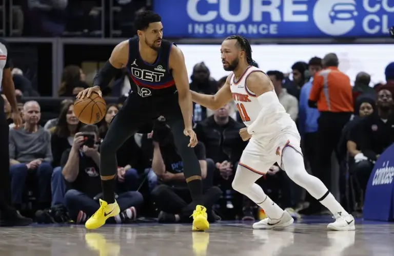 Detroit Pistons forward Tobias Harris (12) is defended by New York Knicks guard Jalen Brunson (11) in the first half at Little Caesars Arena.