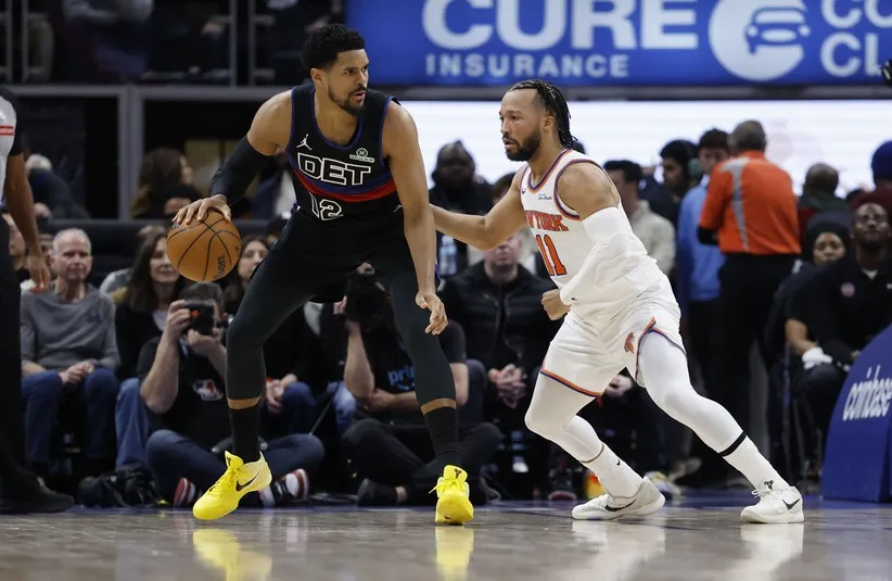Detroit Pistons forward Tobias Harris (12) is defended by New York Knicks guard Jalen Brunson (11) in the first half at Little Caesars Arena.