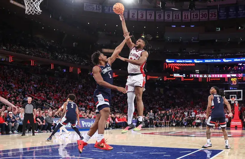St. John's Red Storm forward Zuby Ejiofor (24) shoots past UConn Huskies forward Tarris Reed Jr. (5) in the second half.