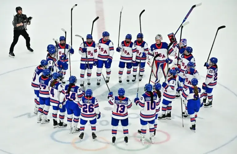 February 9, 2026; Milan, Italy; United States players celebrate after defeating Switzerland in women's ice hockey group A play during the Milano Cortina 2026 Olympic Winter Games at Milano Santagiulia Ice Hockey Arena