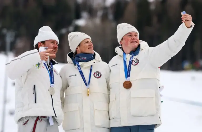 Gold medallist Johannes Hoesflot Klaebo of Norway celebrates on the podium