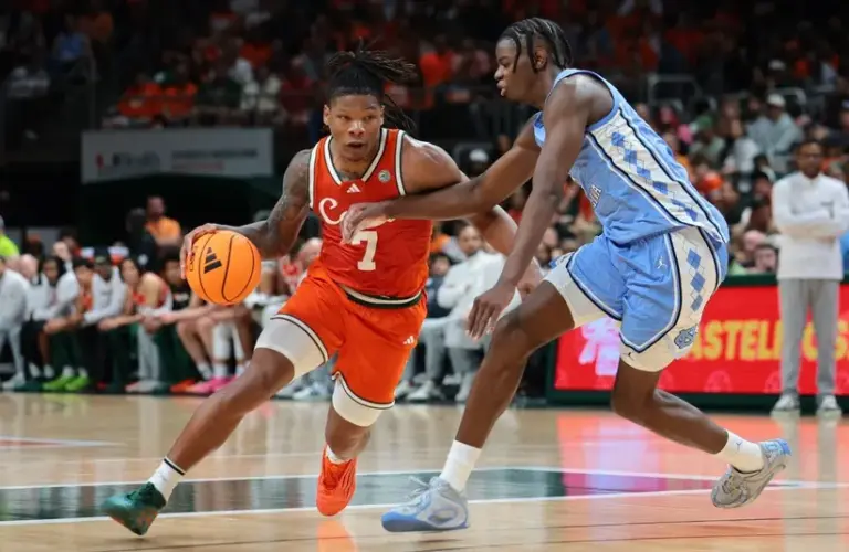 Miami Hurricanes forward Shelton Henderson (7) drives to the basket against North Carolina Tar Heels forward Caleb Wilson (8)