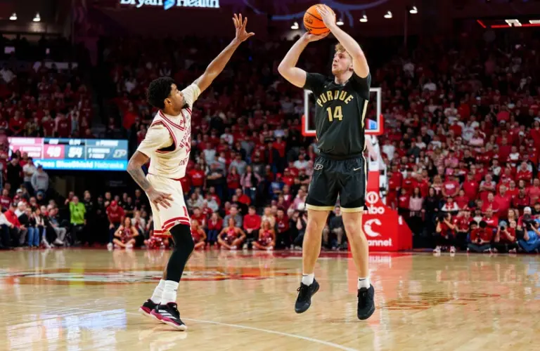 Purdue player shoots a shot against Nebraska.