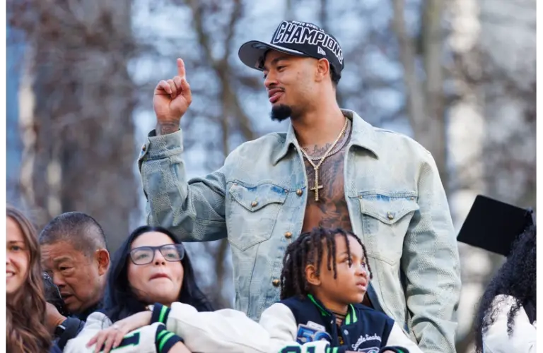 Jaxon Smith-Njigba celebrating at the parade