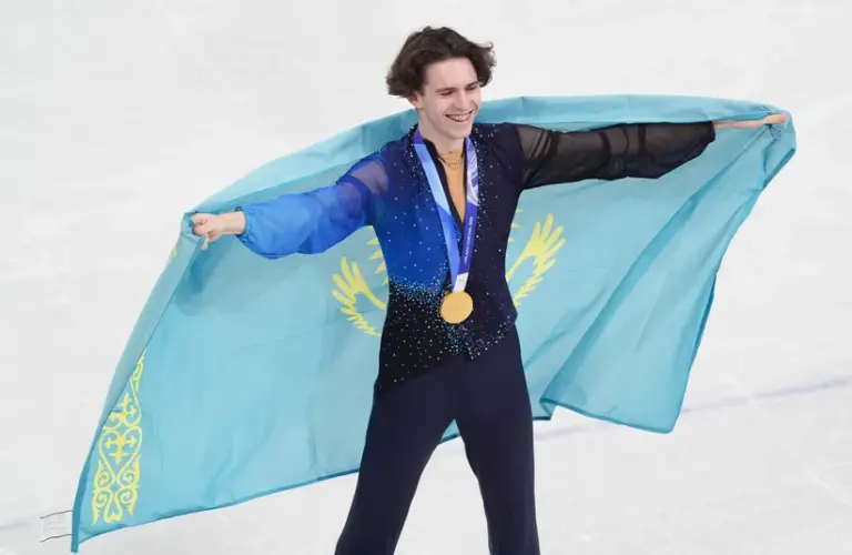 Mikhail Shaidorov of Kazakhstan reacts after winning gold in the men’s singles free program during the Milano Cortina 2026 Olympic Winter Games at Milano Ice Skating Arena.