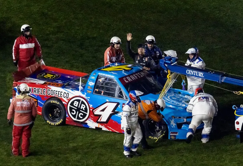 McFarland; Feb 13, 2026; Daytona Beach, Florida, USA; NASCAR Truck Series driver Garrett Mitchell (4) waves to the crowd after crashing during the Fresh from Florida 250 at Daytona International Speedway.