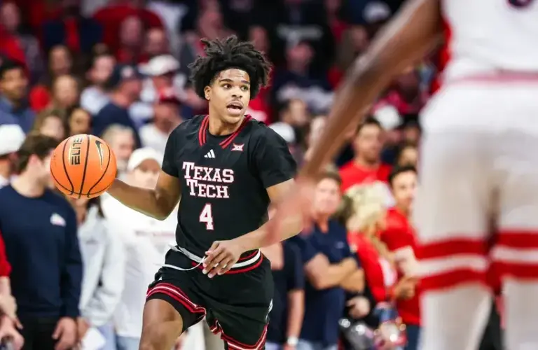 Texas Tech Red Raiders guard Christian Anderson (4) dribbles the ball down the court during the first half of the game against the Arizona Wildcats.