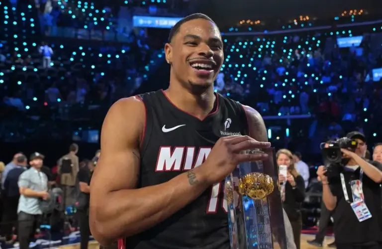 Miami Heat forward Keshad Johnson (16) celebrates with the trophy after winning the slam dunk competition during the 2026 NBA All Star Saturday Night at Intuit Dome.