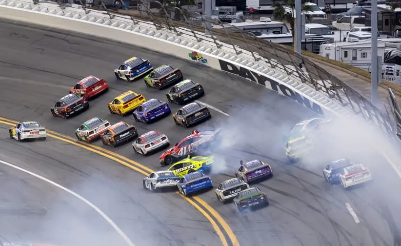 Feb 15, 2026; Daytona Beach, Florida, USA; NASCAR Cup Series drivers Tyler Reddick (45), Ricky Stenhouse Jr. (47) and Chase Elliott (9) battle for the lead as Cole Custer (41), Ryan Blaney (12), Corey Heim (67) and John Hunter Nemechek (42) crash on the last lap of the 68th running of the Daytona 500 at Daytona International Speedway.