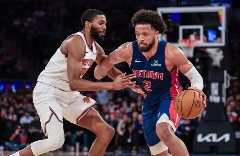 Detroit Pistons guard Cade Cunningham (2) is guarded by New York Knicks guard Mikal Bridges (25)