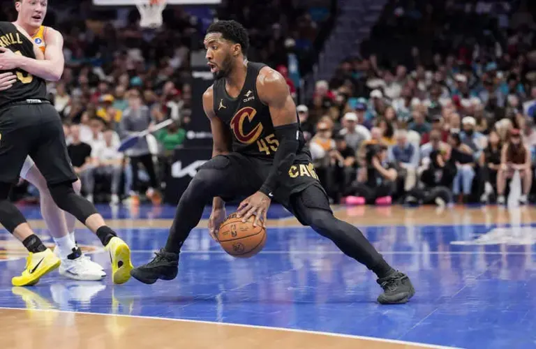 Cleveland Cavaliers guard Donovan Mitchell (45) dribbles against the Charlotte Hornets