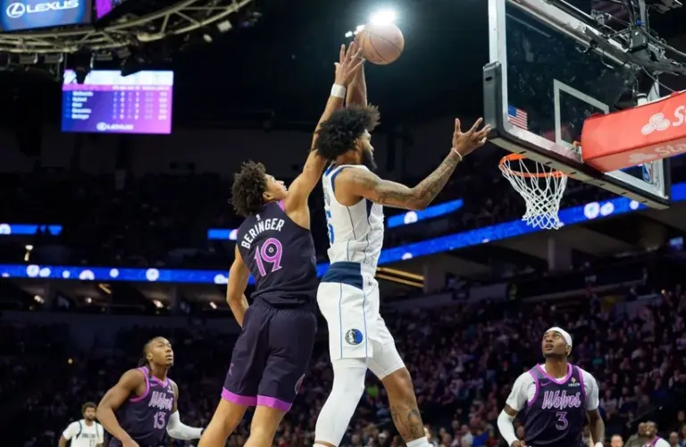 ; Minnesota Timberwolves forward Joan Beringer (19) fouls Dallas Mavericks forward Marvin Bagley III (35).