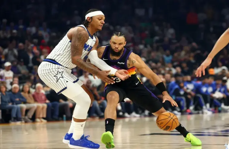 Phoenix Suns forward Dillon Brooks (3) against Orlando Magic forward Paolo Banchero (5)