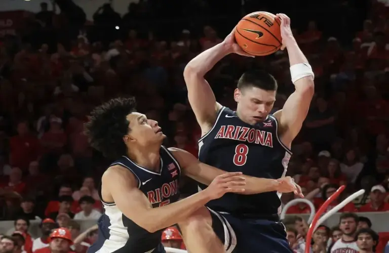 Arizona Wildcats forward Ivan Kharchenkov (8) grabs a defensive rebound against the Houston Cougars