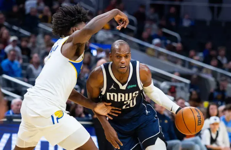 Dallas Mavericks forward Khris Middleton (20) dribbles the ball while Indiana Pacers forward Jarace Walker (5) defends.