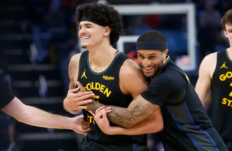 Golden State Warriors guard Gary Payton II (0) embraces forward Gui Santos (15) during the second half against the Memphis Grizzlies.