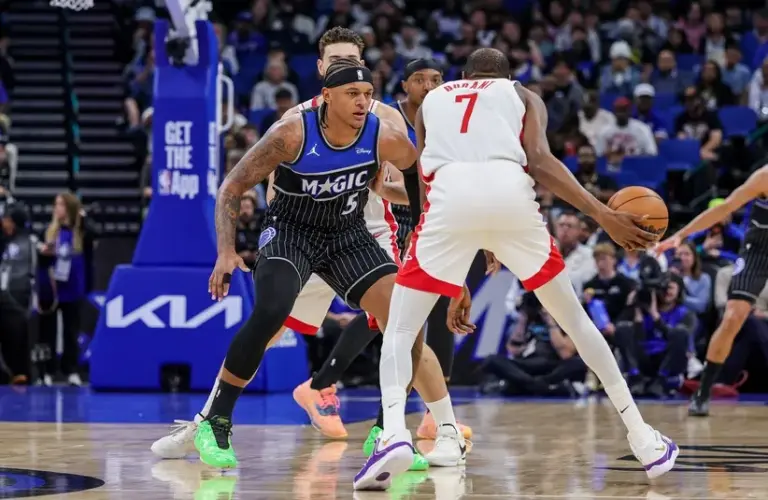 Orlando Magic forward Paolo Banchero (5) defends Houston Rockets forward Kevin Durant (7)