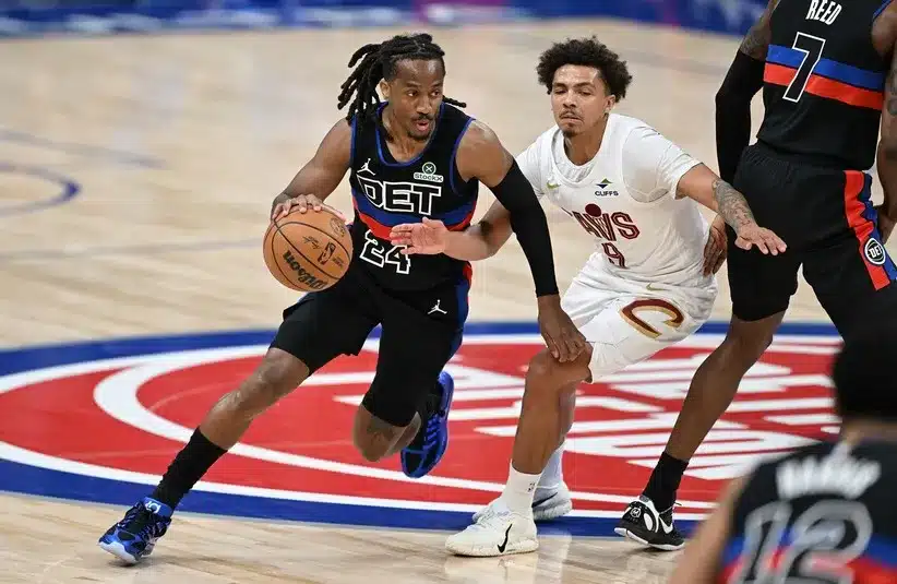 Detroit Pistons guard Daniss Jenkins (24) tries to dribble past Cleveland Cavaliers guard Craig Porter Jr. (9)