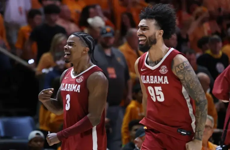 Alabama Crimson Tide guard Latrell Wrightsell Jr. (3) and guard Houston Mallette (95) celebrate after the game