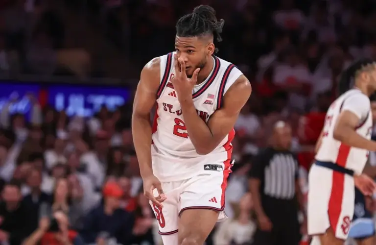 St. John's Red Storm forward Zuby Ejiofor (24) gestures after making a three point shot