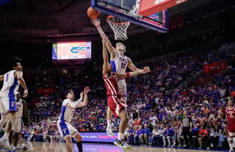 Florida Gators forward Thomas Haugh (10) blocks a shot by Arkansas Razorbacks guard Darius Acuff Jr. (5) during the first half.