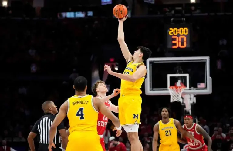 Michigan Wolverines center Aday Mara (15) takes the opening tipoff against Ohio State Buckeyes center Christoph Tilly (13) during the NCAA men's basketball game at the Schottenstein Center in Columbus on Feb. 8, 2026.