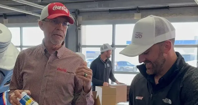 Kyle Petty and Austin Dillon Serve Food At Meal Giving Event.