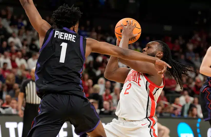 Mar 19, 2026; Greenville, SC, USA; Ohio State Buckeyes Bruce Thornton (2) attempts to shoot the ball on Texas Christian University Horned Frogs Jayden Pierre (1) in the first half during a first round game of the men's 2026 NCAA Tournament at Bon Secours Wellness Arena.