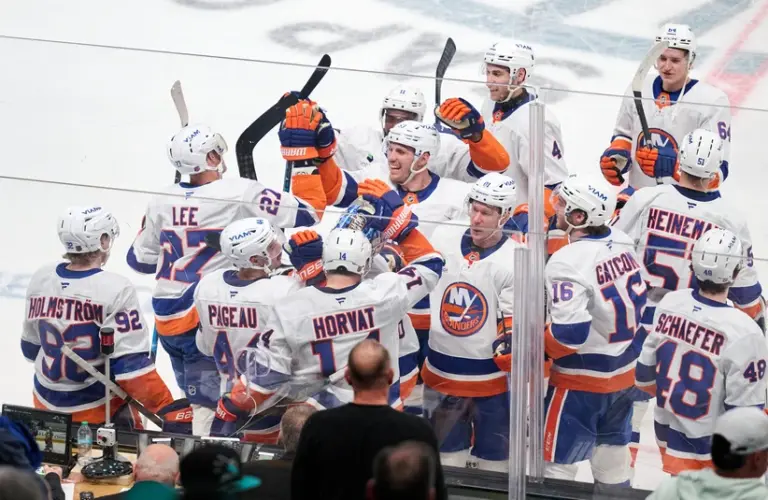 Mar 7, 2026; San Jose, California, USA; New York Islanders center Bo Horvat (14) celebrates with teammates after scoring the game-winning goal against the San Jose Sharks during the overtime period at SAP Center at San Jose.