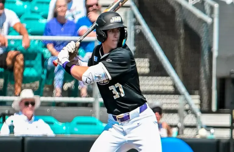 Junior James Madison outfielder Ike Schmidly bats against Coastal Carolina.