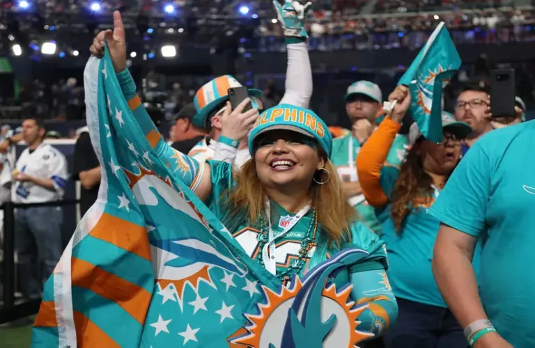 Miami Dolphins fan cheers on her team from the floor of AT&T Stadium for the 2018 NFL Draft at AT&T Stadium.