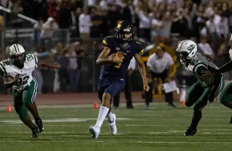 Naples High School's Dominiq Ponder runs the ball