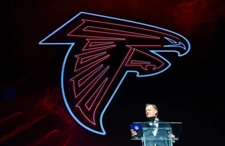 Atlanta Falcons Logo Behind Roger Goodell Announcing A Draft Pick In 2022 NFL Draft