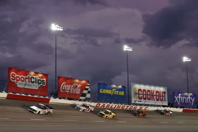 May 6, 2022; Darlington, South Carolina, USA; NASCAR Truck Series driver Zane Smith (38) leads John Hunter Nemechek (4) and Grant Enfinger (23) during the Dead On Tools 200 at Darlington Raceway.
