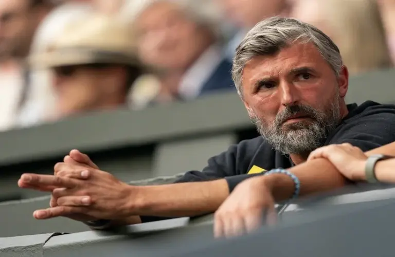 Goran Ivanisevic sitting inside the player's box
