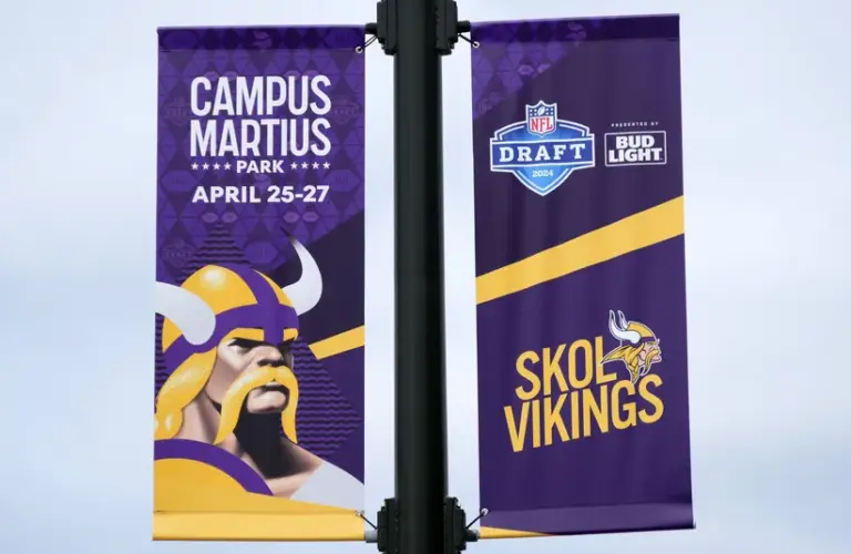 A Minnesota Vikings banner on E. Montcalm St. promoting the 2024 NFL Draft.
