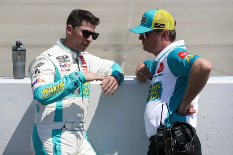 Apr 28, 2024; Dover, Delaware, USA; NASCAR Cup Series driver Denny Hamlin (left) chats with crew chief Chris Gabehart (right) on pit road prior to the Wurth 400 at Dover Motor Speedway.
