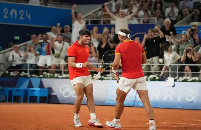 Rafael Nadal and Carlos Alcaraz playing doubles