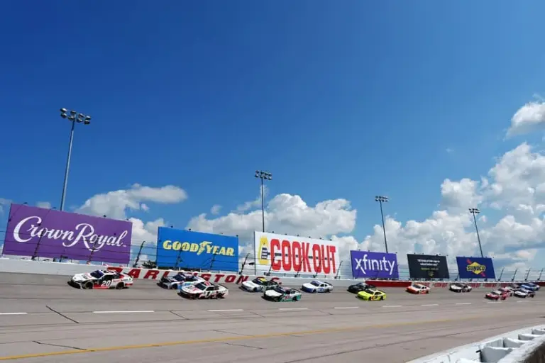 Aug 31, 2024; Darlington, South Carolina, USA; Xfinity Series driver Christopher Bell (20) leads the field during the Sport Clips Haircuts VFW Help A Hero 200 at Darlington Raceway.