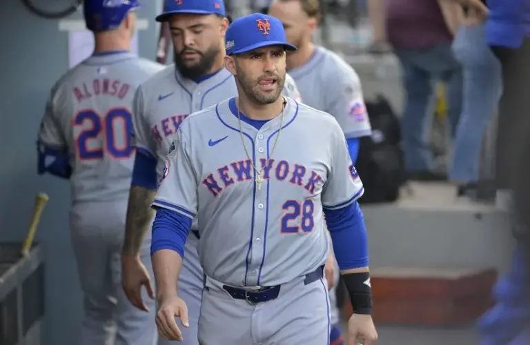 New York Mets designated hitter J.D. Martinez (28) looks on in the dugout.