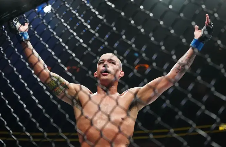 Bryan Battle (blue gloves) reacts