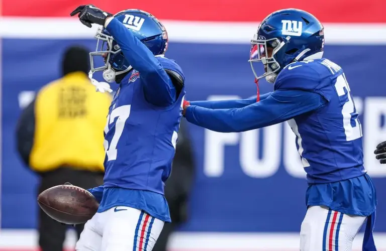 New York Giants cornerback Tre Hawkins III (37) celebrates his interception with safety Jason Pinnock (27)