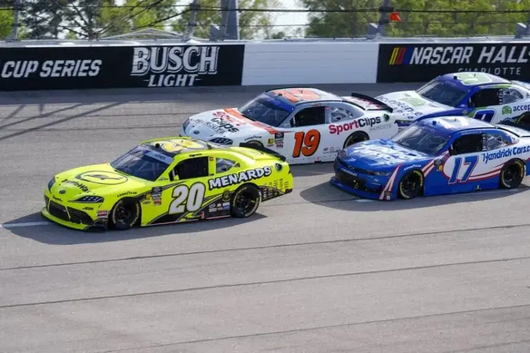 Apr 5, 2025; Darlington, South Carolina, USA; NASCAR Xfinity Series driver Brandon Jones (20) leads driver Christopher Bell (19) and the field into turn one during the Great Clips 200 at Darlington Raceway.