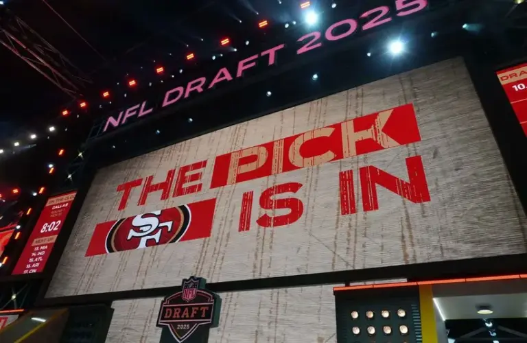 The San Francisco 49ers logo is projected on the video board as the pick is in during the 2025 NFL Draft