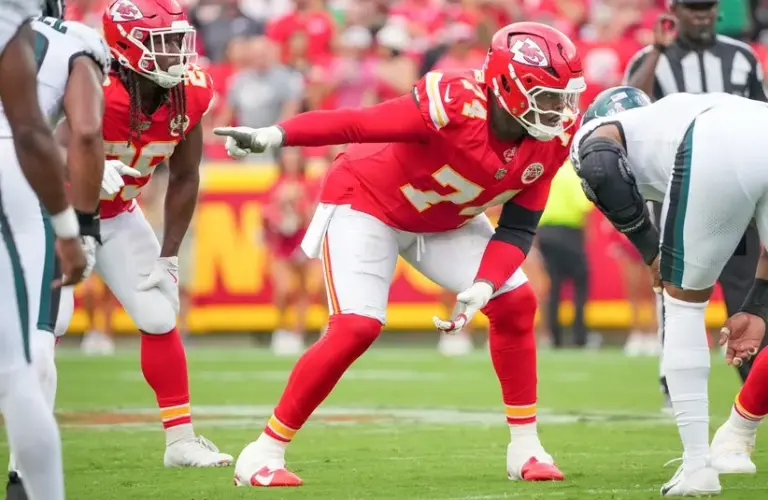 Kansas City Chiefs offensive tackle Jawaan Taylor (74) gestures at the line