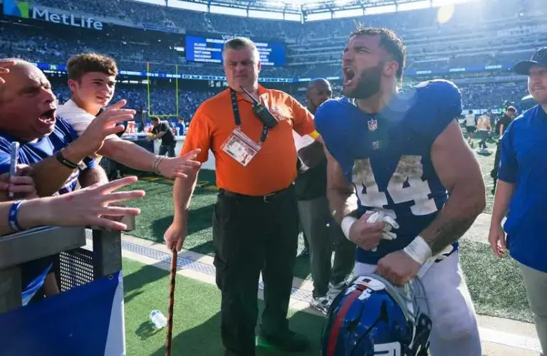 Cam Skattebo shouts after defeating the Los Angeles Chargers